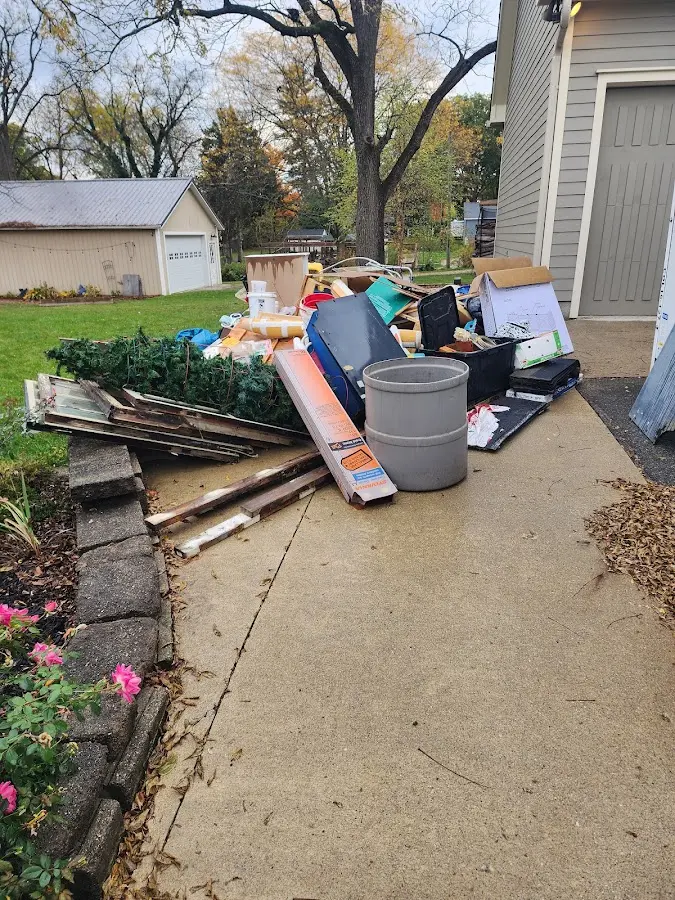 Dumpster being loaded with debris for Commercial Dumpster Rental in Polk City